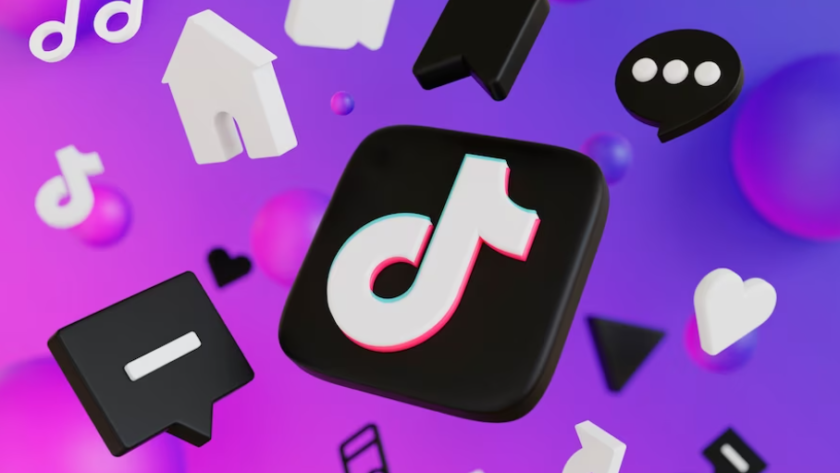 3d icons of TikTok, message, camera, arrow, and heart hang in the air on purple background with bubbles behind