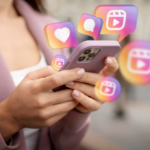 woman in a pink coat holds a phone with icons of Instagram above it