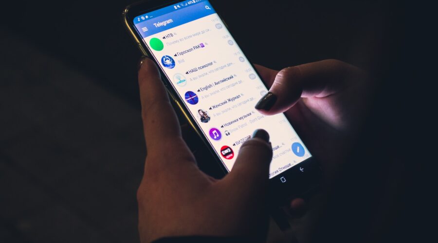 a man opened the telegram application on his phone