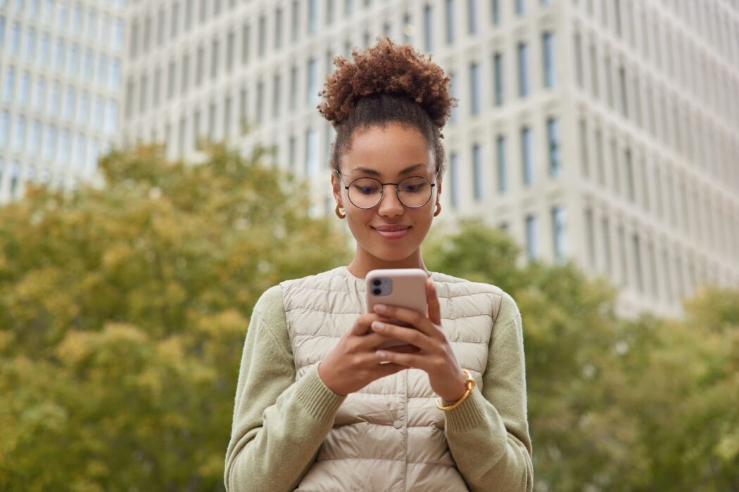 Happy woman chatting on her phone