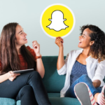 Women Showing Snapchat Icon