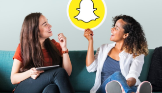 Women Showing Snapchat Icon