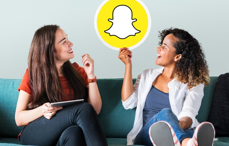 Women Showing Snapchat Icon