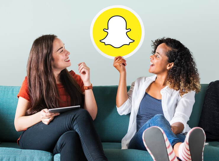 Women Showing Snapchat Icon