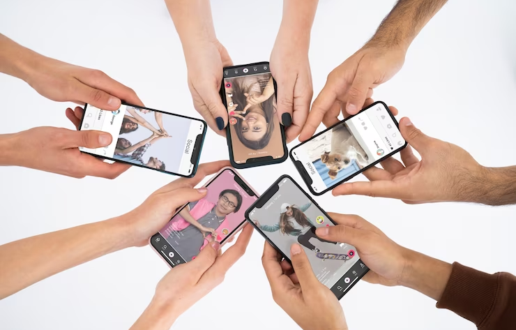 Hands with Iphones Using TikTok