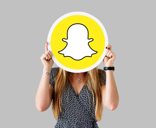 Girl holding Snapchat logo
